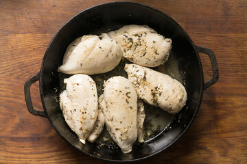 Spicy chicken breast pieces. Meat, lunch. vintage wooden background, top view