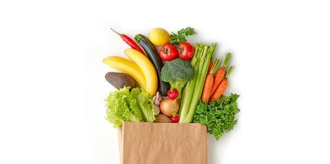 Keuken spatwand met foto Paper grocery bag full of healthy fresh fruits and vegetables top view isolated on white background © Karlis