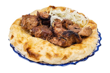 grilled kebab on flatbread on plate isolated on white background