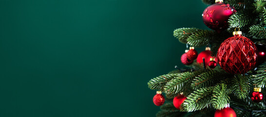 Decorated with ornaments and lights Christmas tree on green background. Merry Christmas and Happy Holidays greeting card, frame, banner. New Year. Noel	
