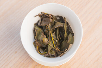 Rare high grade white tea in a gaiwan after a Gong Fu Cha session, asian brewing way. Beautiful full leaves processed by one of the best tea master. Top view.