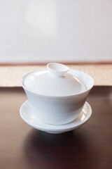 Beautiful white porcelain gaiwan/zhong. Used for Gong Fu Cha brewing. Typical chinese teaware. Put the fresh full dry leaves in the container and let them steep in hot water.