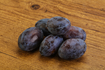 Purple sweet ripe plum heap