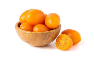 yellow tomatoes in wooden bowl