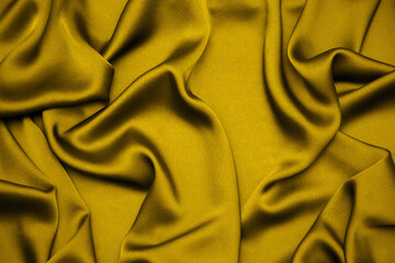 fortuna gold color draped fabric silk background