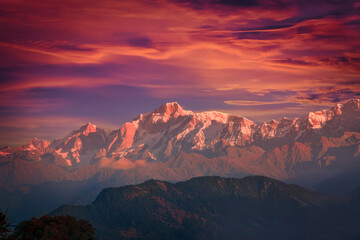 Naklejka premium Bright dramatic mountain sunset sky over Kedarnath peak of Gangotri Range in the western Garhwal Himalaya, Uttarakhand, India. View from Chopta village