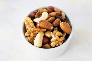 mixed nuts in bowl - on white background