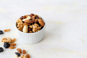 mixed nuts in bowl - on white background copy space