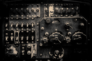 Interior of the old fashioned aircraft glider dashboard of World War II era military transport in black and white.