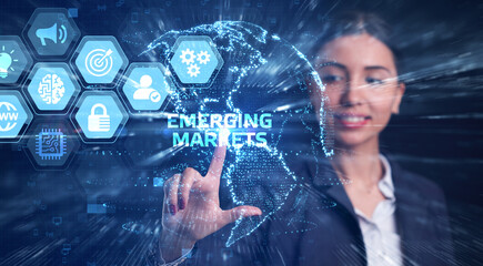 Business, Technology, Internet and network concept. Young businessman working on a virtual screen of the future and sees the inscription: Emerging markets