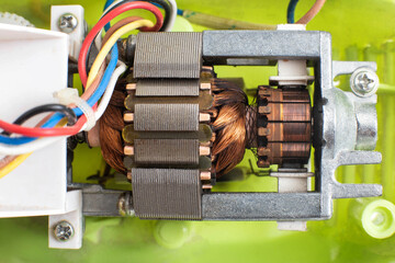 Broken electric motor in a household appliance hand mixer. Malfunction of the rotor and stator of...