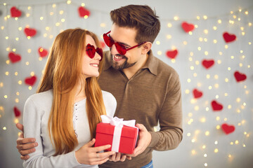 Happy couple celebrating Valentine's Day at home and enjoying spending time together.