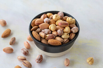 mixed nuts in bowl - on white background