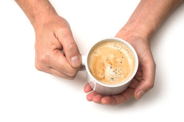 Closeup of hands of man with a mug of coffee on white background