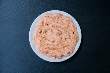 Traditional Turkish or Greek yoghurt meze on black background.