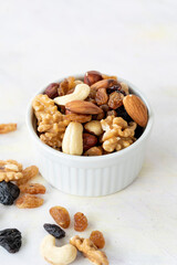 mixed nuts in bowl - on white background