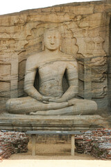 Fototapeta na wymiar Polonnaruwa Sri Lanka Ancient ruins Statue sitting of Buddha in lotus position