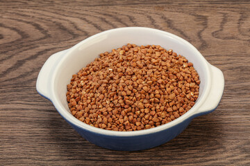 Raw buсkwheat cereal in the bowl