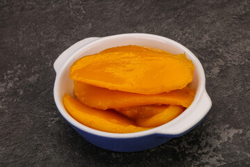 Sweet mango slices in syrop