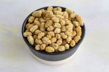 dried mulberry on wooden background - kuru dut