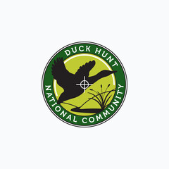 Vector of flying duck, hill, creek, and cattail with aim dot good for duck hunter community logo, badge, emblem, and sticker design