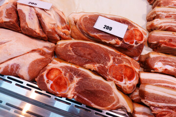 Meat trade. Pork on the counter in the store. Close-up