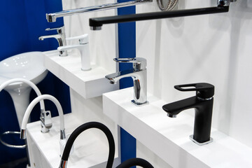 Modern water taps of different types in a plumbing store