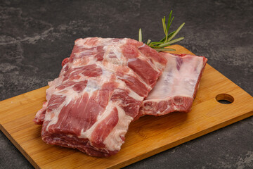 Raw pork ribs served rosemary