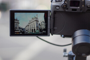 Camera recording the white buildings from Piccadilly Circus