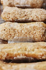 
Delicious eclairs with vanilla cream close up