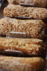
Delicious eclairs with vanilla cream close up