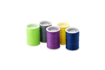 Four spools with multi-colored threads isolated on a white background.