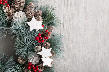 Part of Christmas wreath on light background. New year decor, copy space