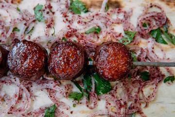 Turkish sausage also known as Sucuk. Grilled or barbecued Turkish sausage on the table in the Turkish restaurant.