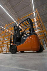 Forklift loader in new empty modern storehouse. Wide angle