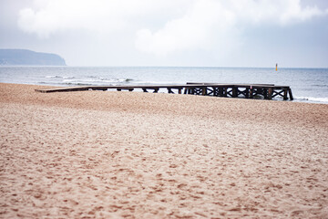 pier by the sea on a cloudy day