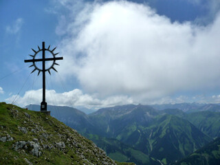 Summit cross of Kohlbergspitze mountain in Tyrol, Austria