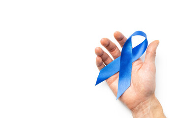 Prostate awareness. Blue ribbon in hands isolated on white background. Awareness prostate cancer of men health in November. Healthcare, International men, Father day.