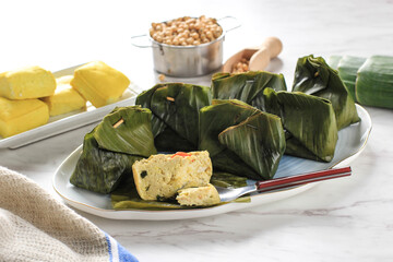 Pepes Tahu is Indonesian Spiced Tofu Wrapped with Banana Leaf and Steamed, Typically Indonesian Food from West Java (Sundanese). Steamed Tofu with Asian Basil