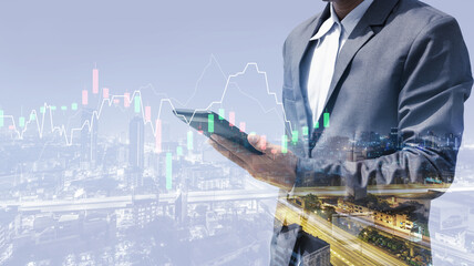 double exposure of business man using smartphone for trading stock online concept with night city background. technology digital financial with stock chart growth analysis marketing graph.