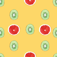 Seamless pattern illustration with green kiwifruit and red grapefruit isolated on orange background - 394695042