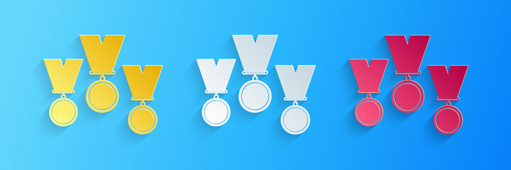 Paper cut Medal set icon isolated on blue background. Winner simbol. Paper art style. Vector.