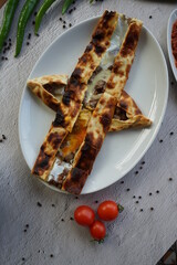 Assorted pita bread on stone background