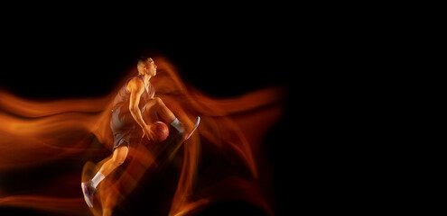 Flyer with copyspace. Young east asian basketball player in action and motion jumping in mixed...