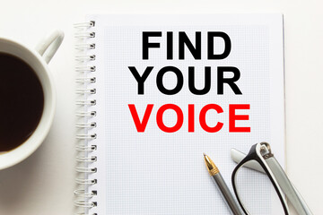 text FIND YOUR VOICE in a magnifying glass, office concept, business concept, Finance