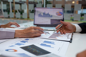 Team of business people working together in the meeting room office,
teamwork background charts and graphs banner, double exposure successful teamwork,business planning concept.
