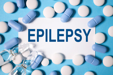 EPILEPSY. TEXT on white paper on a blue background.