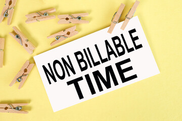 NBT as Non Billable Time, text on white paper on yellow paper
