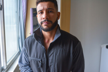 young black latino man cozy looking at camera