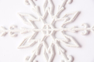 Obraz na płótnie Canvas Christmas decor snowflake on white background with copy space